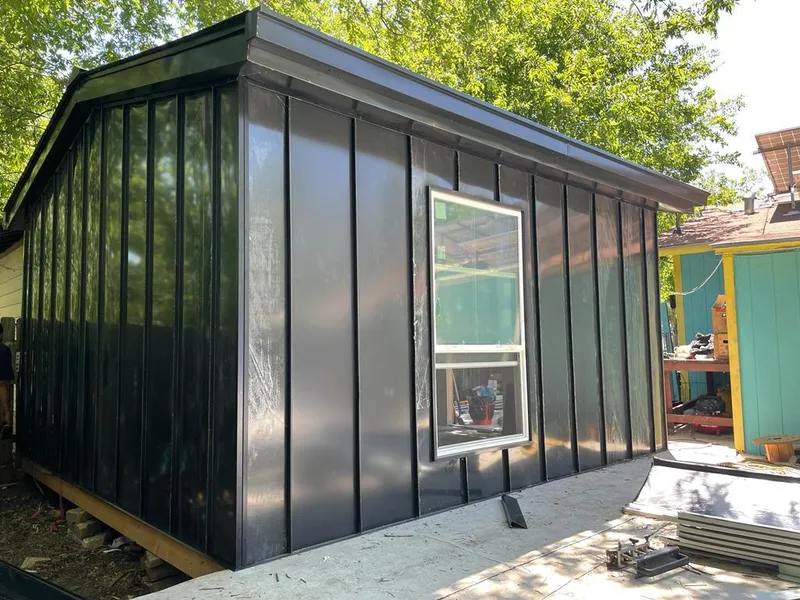 Black standing seam metal wall panels for Roof Inspection in Hickory Creek