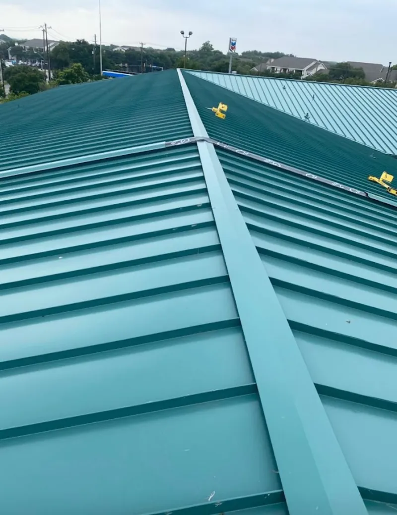 Green commercial metal roof ridge and valley for Metal Roof Repair in Hickory Creek