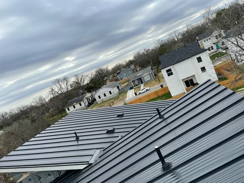 Standing seam metal roof panels with vents for Skylight Repair in Hickory Creek